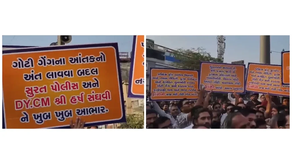 Protesters holding orange banners with Gujarati text during a public demonstration on a city street.