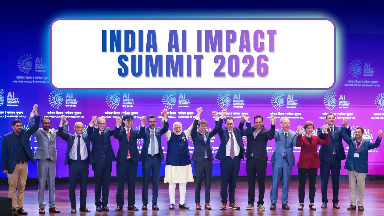 World leaders and tech executives stand on stage holding hands under a large “India AI Impact Summit 2026” banner at an international AI conference in India.